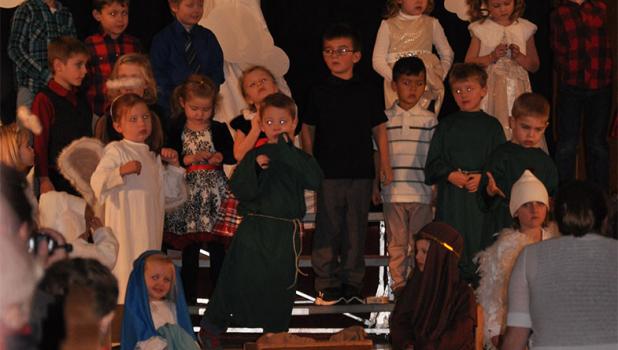 Baby in a manger Pre-school and kindergarten students at Sacred Heart Area School, Staples presented their Christmas program at 6 p.m., Dec. 21 with singing and speaking parts on how the animals came to adore baby Jesus.