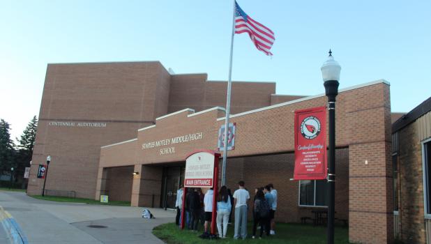 A number of students gathered outside Staples-Motley Middle/High School to spend about a half hour in prayer prior to the start of school Sept. 23. This was in conjunction with the national “See You at the Pole” event, an annual student-led prayer gathering at the school flag pole. The event in Staples was organized by the local chapter of Fellowship of Christian Athletes (FCA). (Staples World photo by Dawn Timbs)