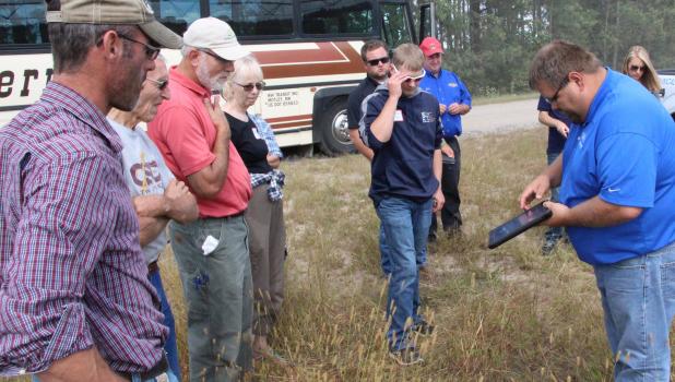 Advances in agriculture technology Brian Boyne of Minnesota Valley Irrigation demonstrates how an ipad can remotely control the irrigation system during the Central Lakes College Ag and Energy Center’s field day on Aug. 26.