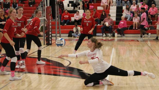 Hitting the floor to save the volleyball point Izzy Becker stretches out as she goes to the floor to dig up a tipped ball in the match against Pelican Rapids. Becker had 28 digs in the match, as well as three back-row kills. (Staples World photos by Mark Anderson)