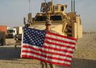 Master Sergeant (Retired) Izaak Schafer is pictured with the United States flag in Iraq, during his deployment to that country in 2011-2012. Schafer, now of Swanville, is a Staples native. He retired this past June as a Master Sergeant, after 21 1/2 years of military service. (Submitted photo)