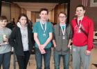 Checkmates bring home hardware from Brainerd Tournament. From left, Keegan Bestland first; 4-6 division; Rose Han, Shawn Decker, fifth; 7-12 division; Lenny Decker, fourth; 7-12 division; and Noah Han, seventh; 7-12 division. (Submitted photos)