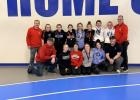 Coaches, wrestlers and alternates from the Staples-Motley girls wrestling team that is sending three girls to state, had one more section finalis and two more medal winners, celebrated after their successfule tournament. Front row from left, coach Kodiey Lind, Talyn Lind, Ali Reese, Kalee Winter, Lilly Czechowicz and Head Coach Holton Truax; back row, coach Chris Dobson, Jocelyn Vogt, Anika Tureson, Kana Reese, Isabelle Dobson, Leah Greenwaldt, Aubrie Houchin, Maddie Kist and coach Steve Jennissen. (Submitt