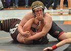 Kyle Serich gets close pinning his opponent during the conference wrestling tournament Jan. 28. (Submitted photo)