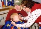 Grant Bestland, about a year old, looked up at his Grandma Barb Rach during his first hair cut at her salon in Verndale. Holding him is his mother, Gretchen (Rach) Bestland. That was the start of many haircuts Grant would receive over the years from his one and only barber. On back  page, Grant’s still all smiles at the salon a few years later. (Submitted photos)