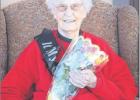 Harriet Dent celebrated her 100th birthday (actual date, July 18, 2020) at her current residence, Rising Mountains Assisted Living in Bigfork, Montana. Friends from Staples had planned to attend the milestone event, but due to COIVID-19 had to cancel their trip. Harriet smiles for a mask-free socially distanced photo. (Photo by Mackenzie Reiss, Bigfork Eagle) 