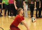 Cody Noble returns a serve, as teammate Isaac Swensrud looks on during the Staples-Motley High School’s powder-buff volleyball tournament held Feb. 2. (Staples World photo by Mark Anderson)