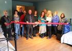 The Staples Motley Area Chamber of Commerce held a ribbon cutting Nov. 17, at A Daughter’s Love in Staples commemorating the opening of the new business. Pictured from left, Barb Cline, Stephanie Jordahl, Dan Orth, Bruce Brotherton, Chuck Mayer, Alicia Truax, Christine Tollefson, Megan Haber, Carla Kuchinski, Dawn Hagenson and Sandy Knosalla. The photo shows the newly remodeled bedroom at the care facility. (Staples World photo by Mark Anderson)