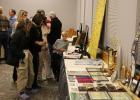 Hall of Fame fans review the display table featuring this year’s inductees.