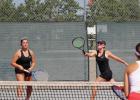 Madison Perius sends a cross-court shot over the net as partner Natalie Hanson is ready for the next shot. (Staples World photos by Mark Anderson)