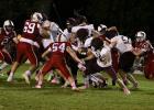 The Staples-Motley defense surrounds a Pillager running back, with Riley Reese (54) ready to make the tackle. (Staples World photo by Mark Anderson)