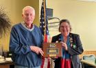 Lion Ed Jordahl (left), longtime member and past president of the Motley Lions Club, received a plaque recently for his work with the club and for their being named a Model Club by Lions Clubs International Foundation. Also pictured is District Superintendent Tracy Voight, who presented the award to Jordahl. (Submitted photo)